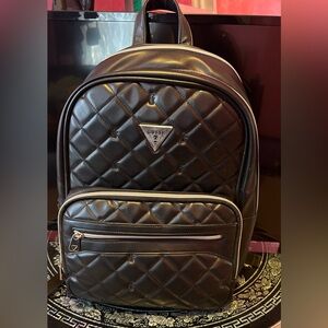 GUESS QUILTED BLACK AND SILVER BACKPACK. EUC LIKE NEW